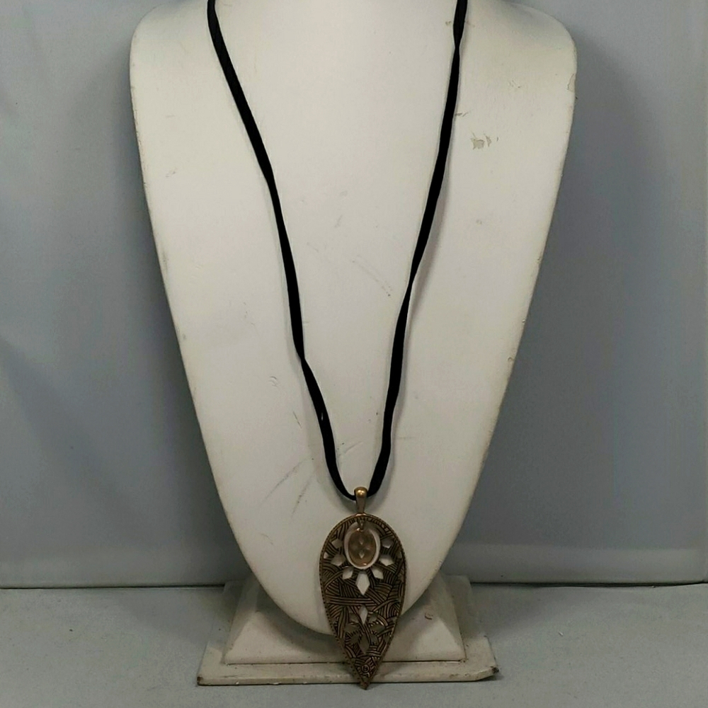The sak corded rope with hammered medallion necklace